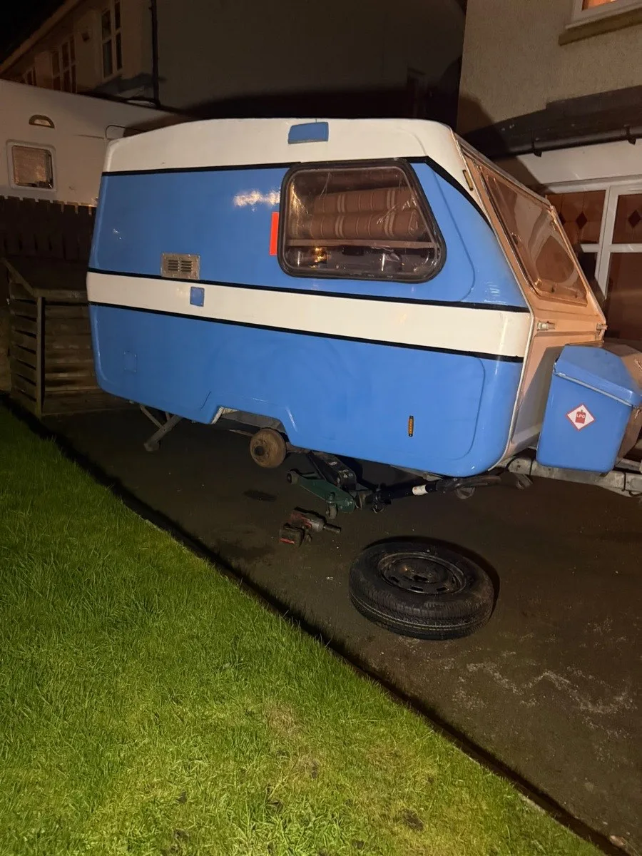 A wheel and tyre being worked on