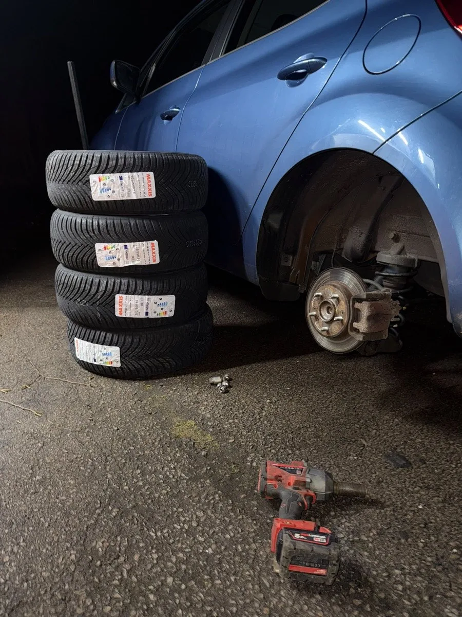 A vehicle raised during a wheel change
